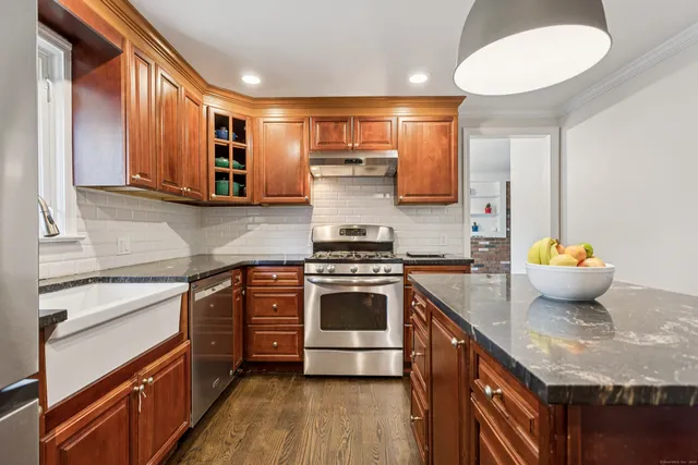 a kitchen with a stove and a sink