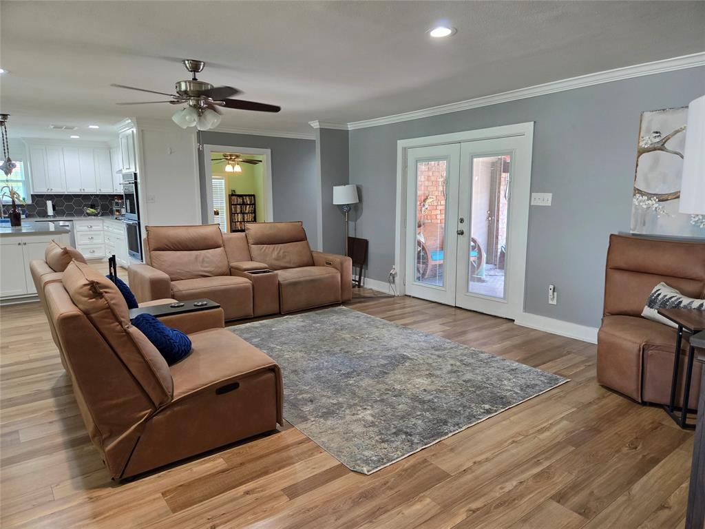 1023 Ridgefield Drive Plano, TX 75075 - Photo 39 of 39 a living room with furniture and a wooden floor