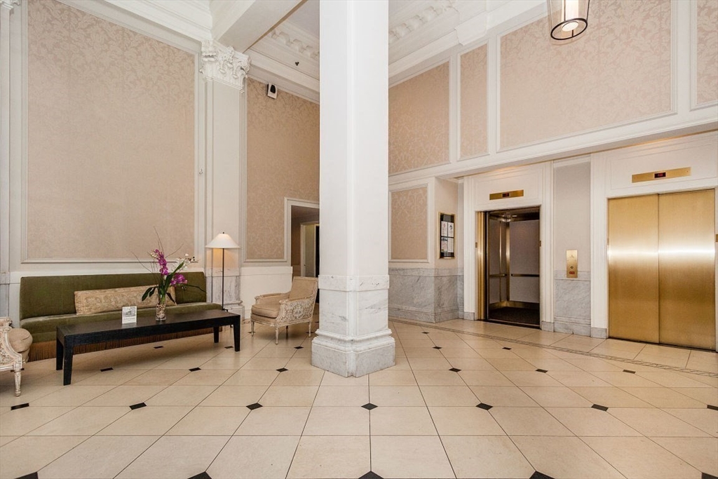 21 Beacon Street, Unit 5I Boston, MA 02108 - Photo 9 of 13 a living room with furniture