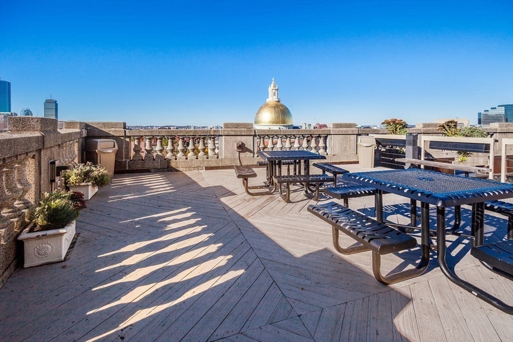 21 Beacon Street, Unit 5I Boston, MA 02108 - Photo 10 of 13 a view of a chairs and table on the terrace