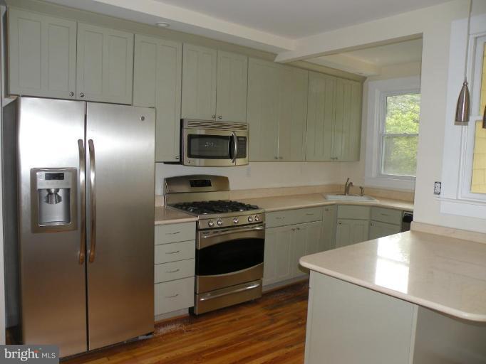 629 Deepdene Road Baltimore, MD 21210 - Photo 11 of 13 a kitchen with a refrigerator sink and stove