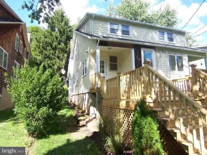 629 Deepdene Road Baltimore, MD 21210 - Photo 13 of 13 a front view of a house with a garden