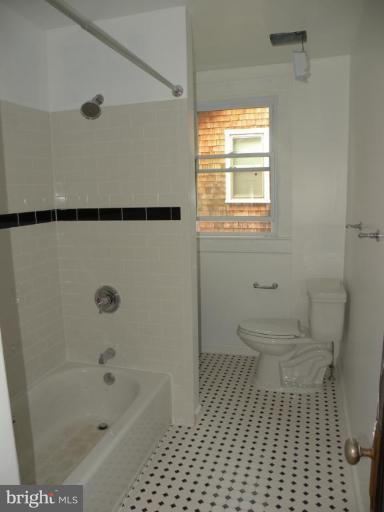 629 Deepdene Road Baltimore, MD 21210 - Photo 6 of 13 a bathroom with a toilet a window and a shower