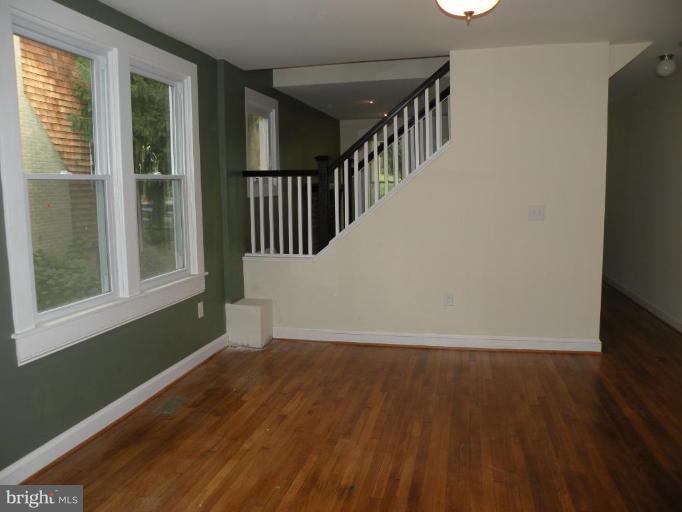 629 Deepdene Road Baltimore, MD 21210 - Photo 9 of 13 a view of a hallway with wooden floor and entryway