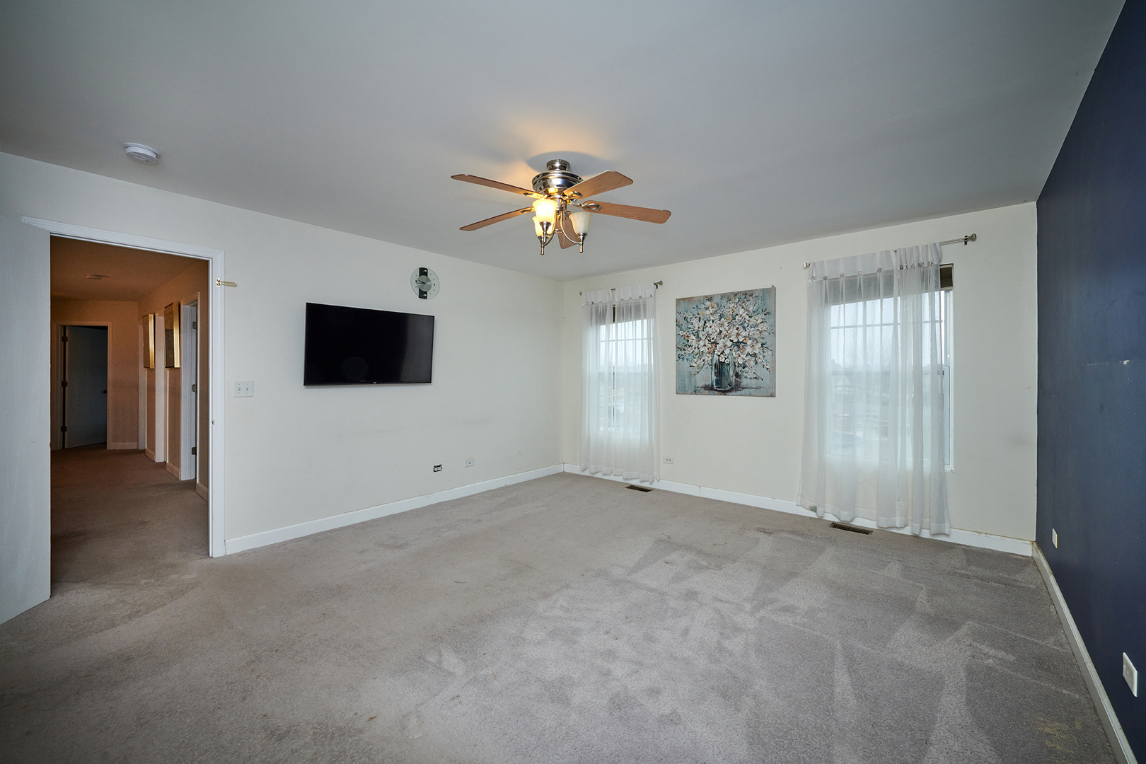 540 Wynbrooke Road Romeoville, IL 60446 - Photo 12 of 27 a view of a livingroom with a flat screen tv