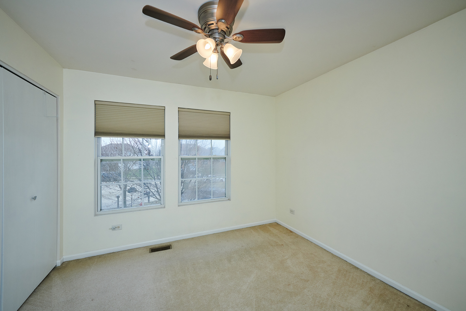 540 Wynbrooke Road Romeoville, IL 60446 - Photo 20 of 27 an empty room with a window and a fan