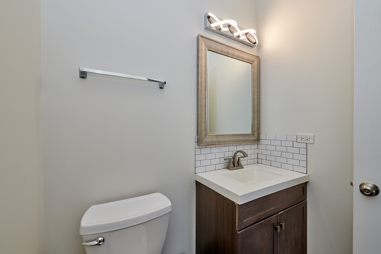 540 Wynbrooke Road Romeoville, IL 60446 - Photo 24 of 27 a bathroom with a toilet sink and mirror