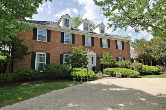 69 Round Barn Road Barrington Hills, IL 60010 - Photo 1 of 15 a front view of a house with a yard
