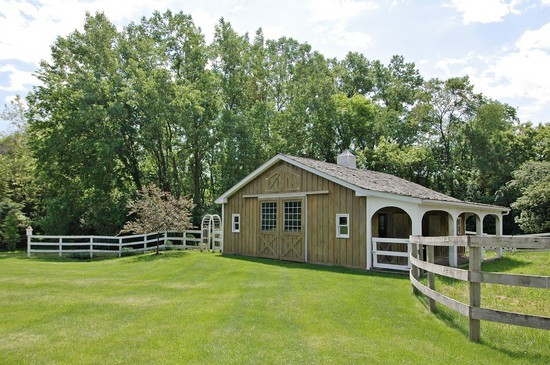 69 Round Barn Road Barrington Hills, IL 60010 - Photo 13 of 15 a front view of a house with a garden