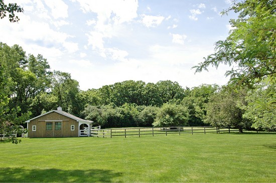 69 Round Barn Road Barrington Hills, IL 60010 - Photo 14 of 15 a white house with a big yard and large trees