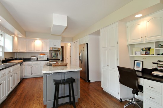 69 Round Barn Road Barrington Hills, IL 60010 - Photo 5 of 15 a kitchen with stainless steel appliances a dining table chairs microwave and sink