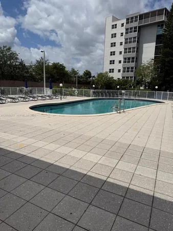 a view of a swimming pool with a patio