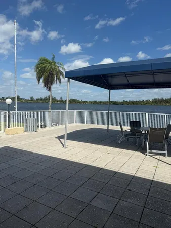 a outdoor patio with table and chairs