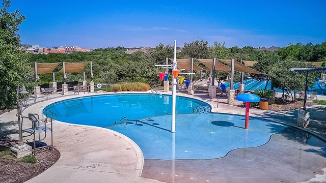 a view of a swimming pool with a patio
