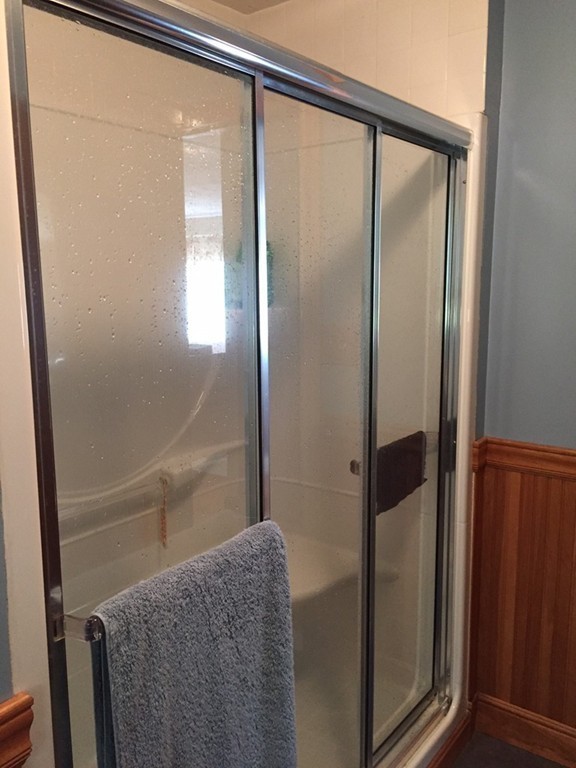 39 Old Bolton Road Hudson, MA 01749 - Photo 12 of 19 a bathroom with a glass shower door