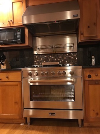 39 Old Bolton Road Hudson, MA 01749 - Photo 3 of 19 a stove top oven sitting inside of a kitchen