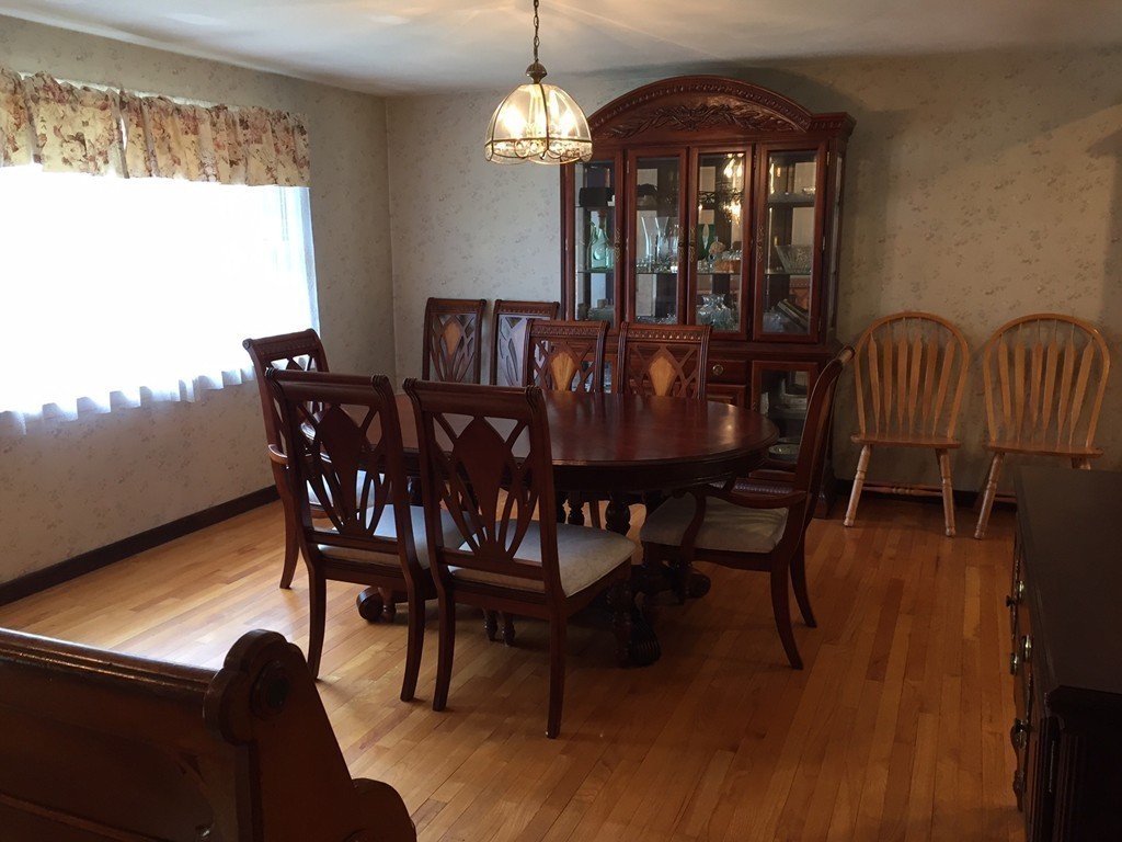 39 Old Bolton Road Hudson, MA 01749 - Photo 8 of 19 a view of a dining room with furniture window and wooden floor