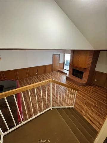 a kitchen with stainless steel appliances granite countertop a sink and wooden cabinets