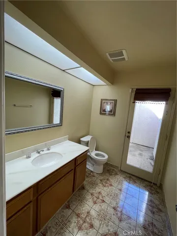 a view of an empty room with a fireplace