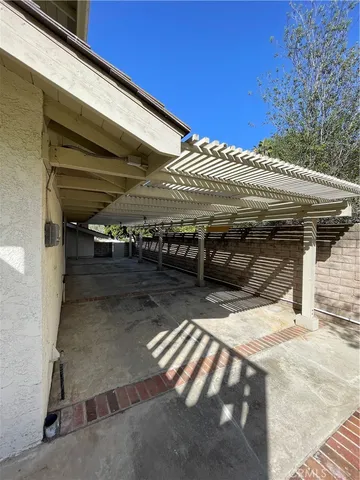 a view of closet with wooden floor