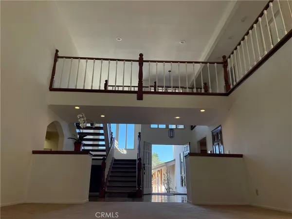 a view of a living room with a floor to ceiling window and a garage