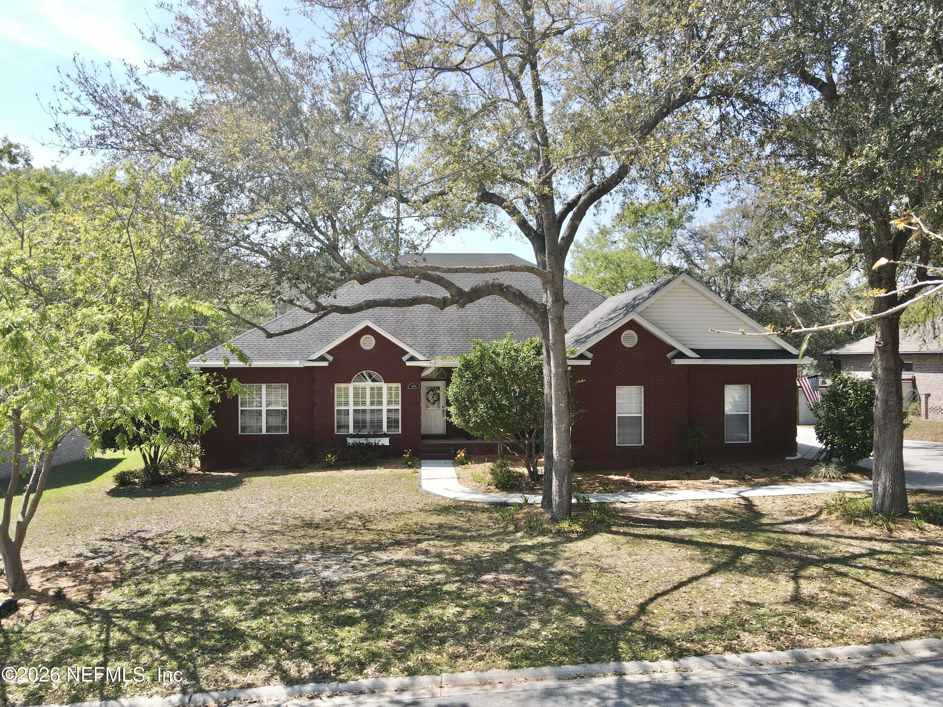 6116 Copper Drive Macclenny, FL 32063 - Photo 1 of 21 a front view of a house with a yard covered in snow