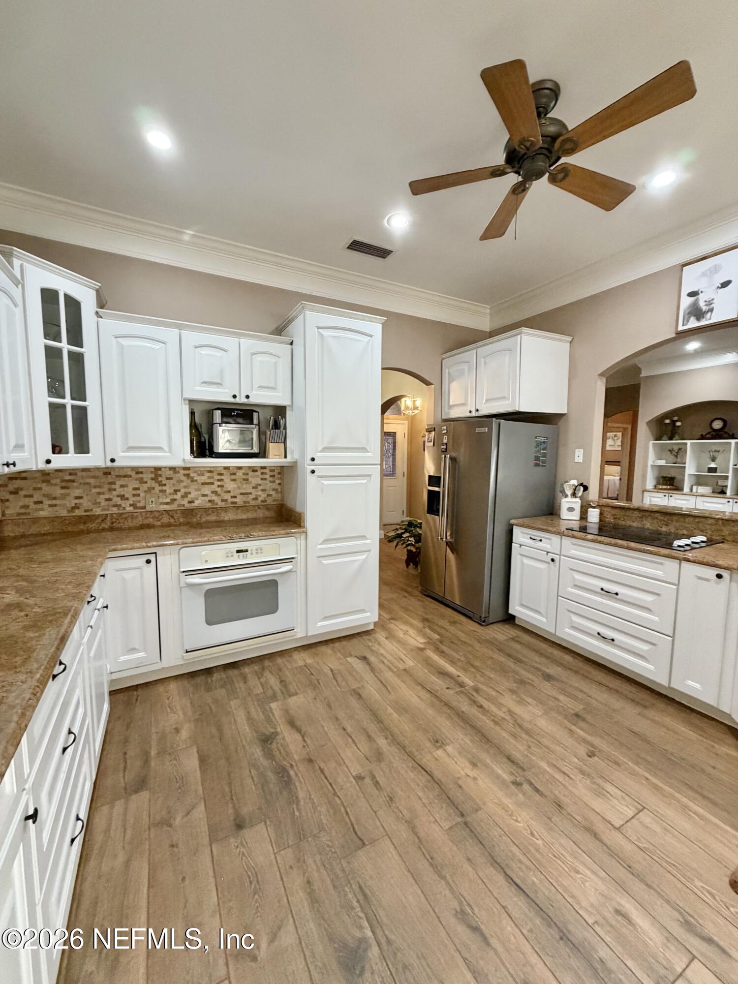 6116 Copper Drive Macclenny, FL 32063 - Photo 12 of 21 a kitchen with granite countertop a refrigerator and a sink
