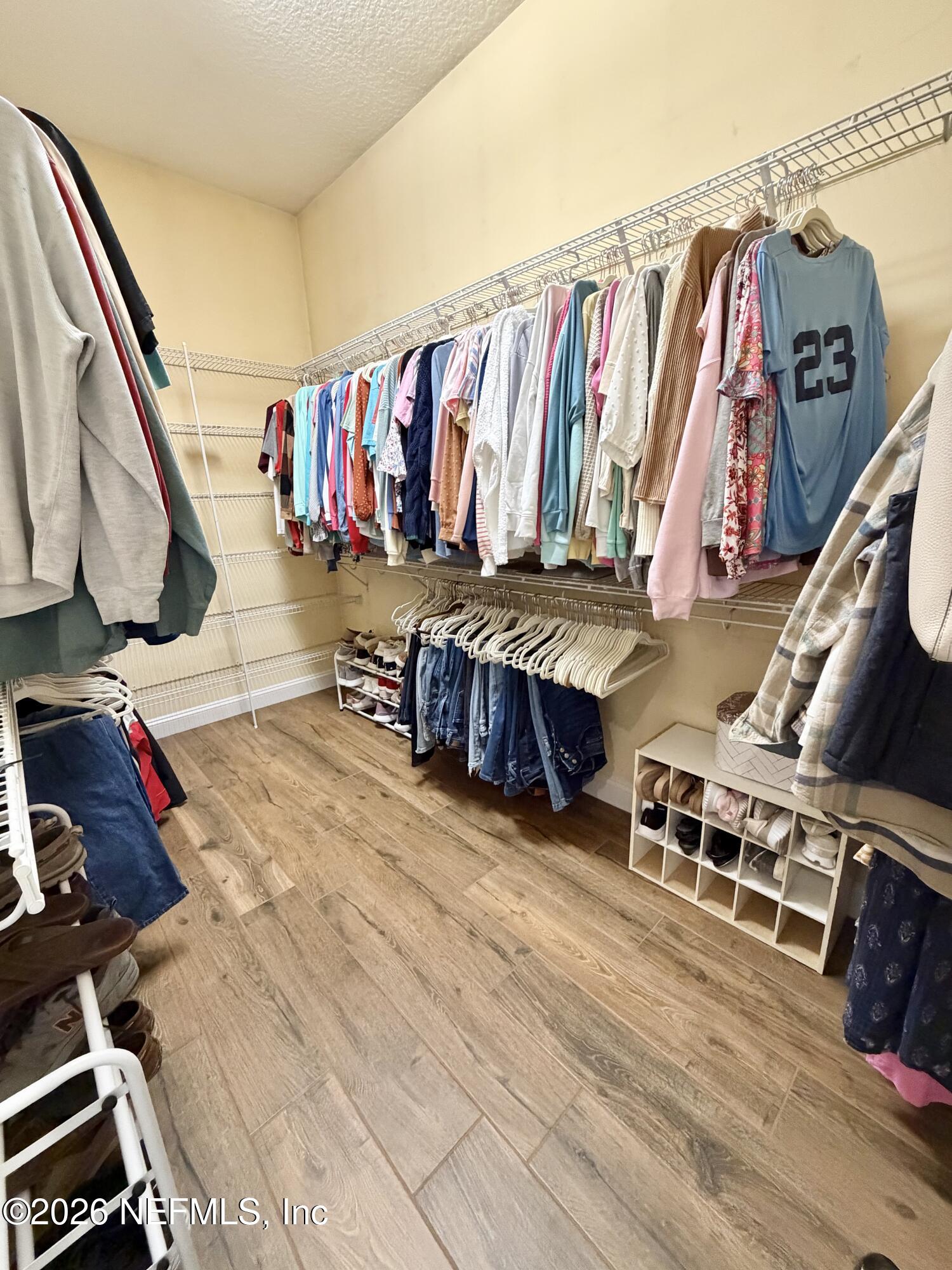 6116 Copper Drive Macclenny, FL 32063 - Photo 14 of 21 a view of walk in closet with clothes and shoes