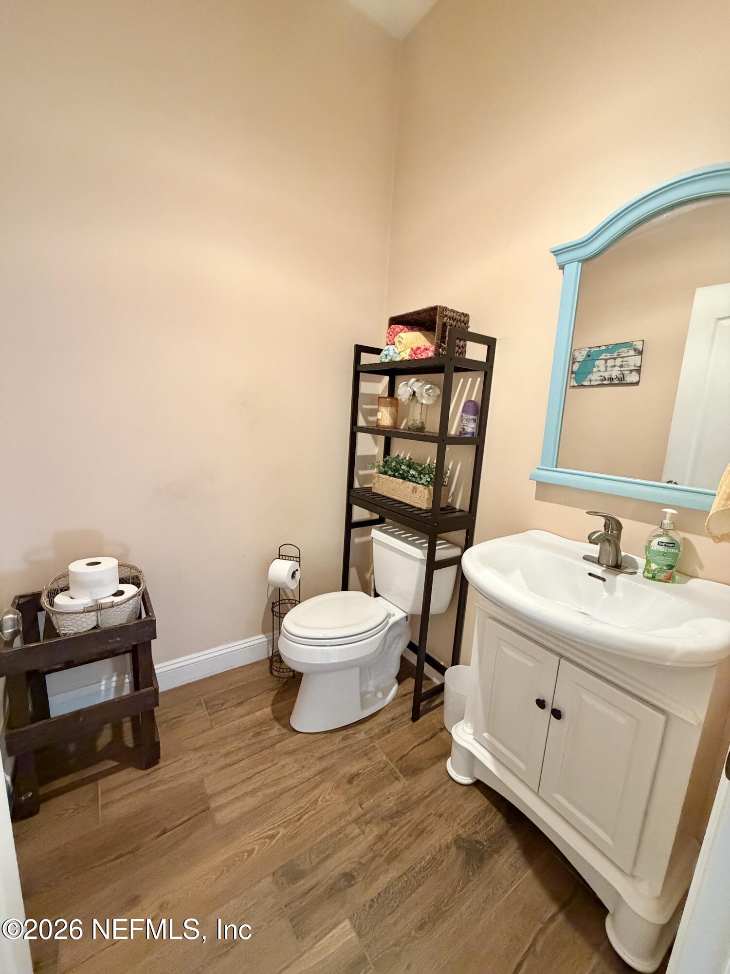 6116 Copper Drive Macclenny, FL 32063 - Photo 16 of 21 a bathroom with a sink toilet and vanity