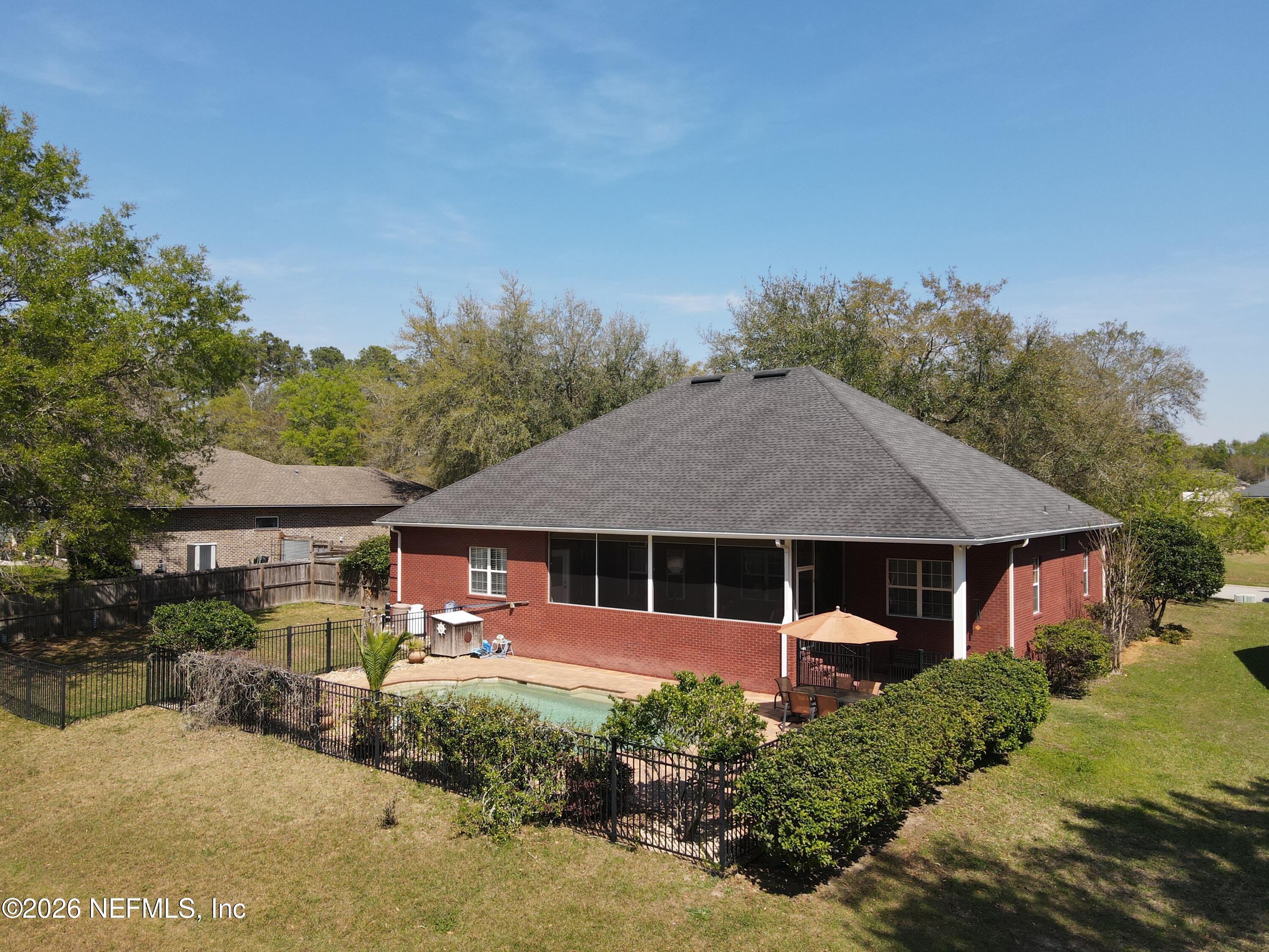 6116 Copper Drive Macclenny, FL 32063 - Photo 5 of 21 a front view of a house with garden