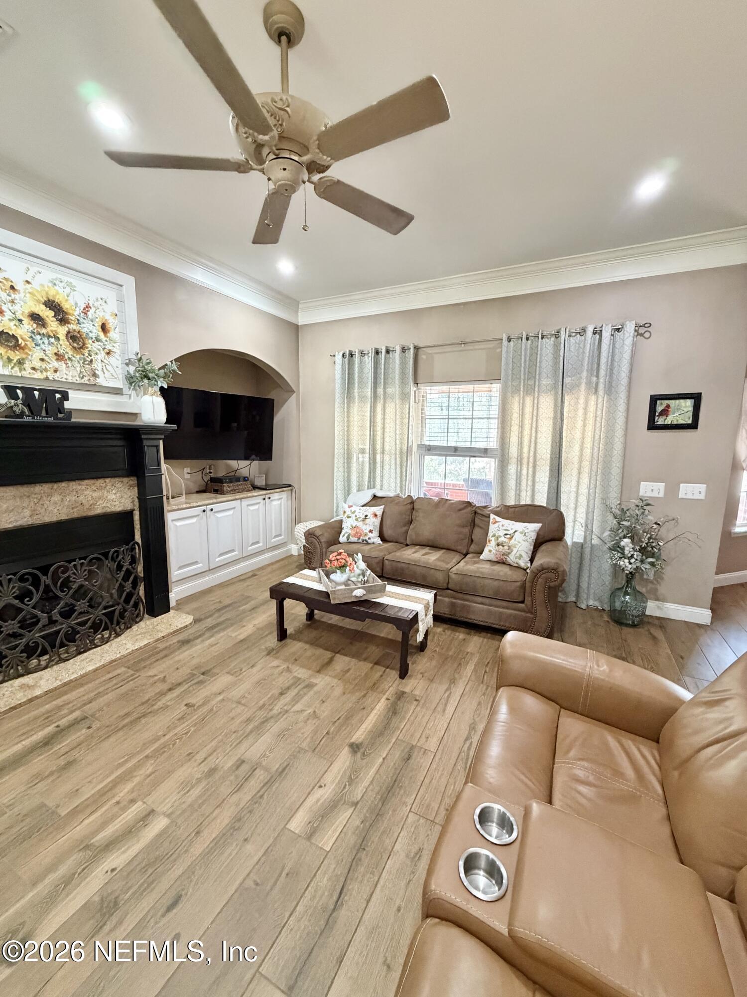 6116 Copper Drive Macclenny, FL 32063 - Photo 8 of 21 a living room with furniture and a flat screen tv