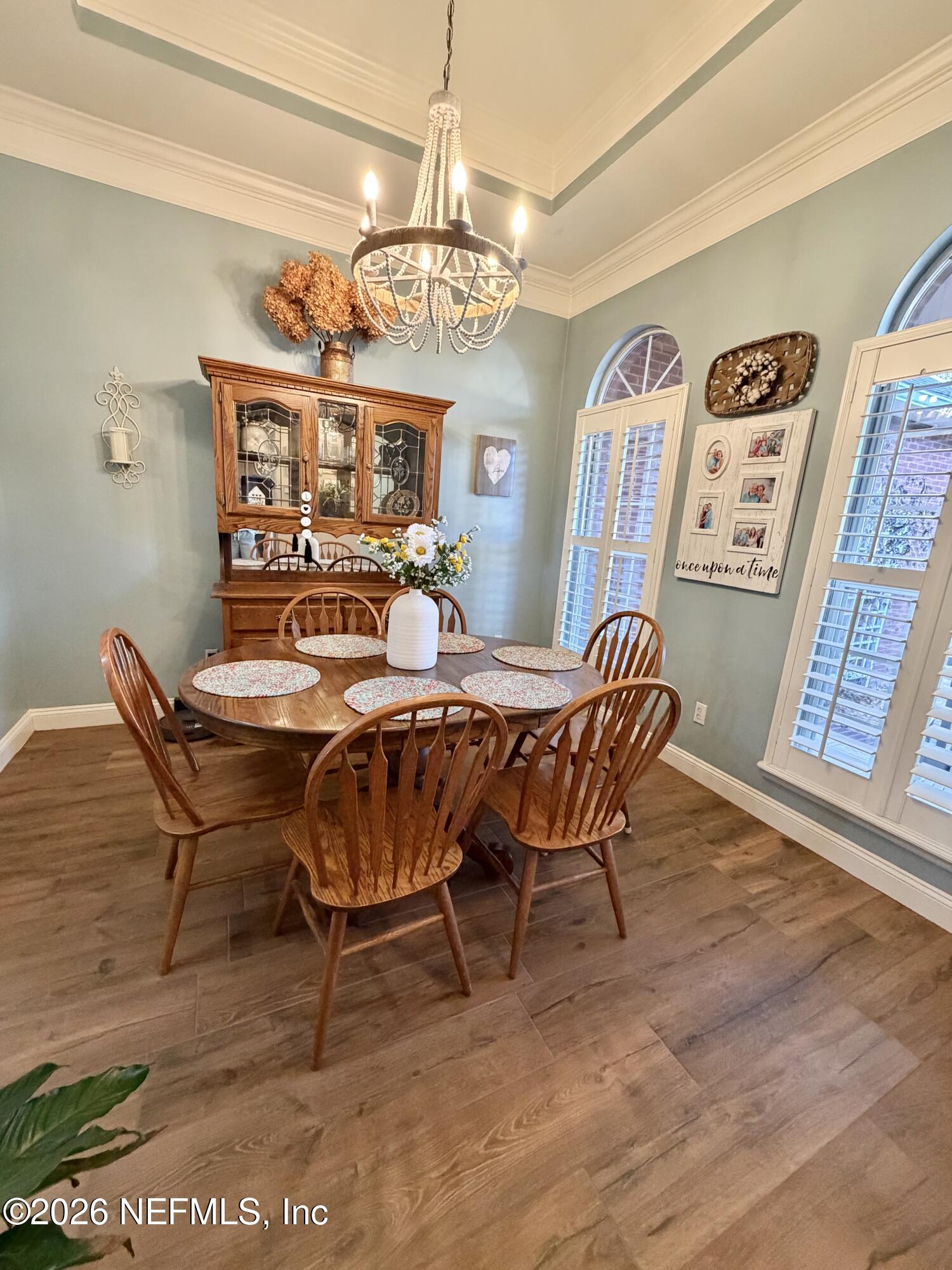 6116 Copper Drive Macclenny, FL 32063 - Photo 9 of 21 a view of a dining room with furniture and chandelier