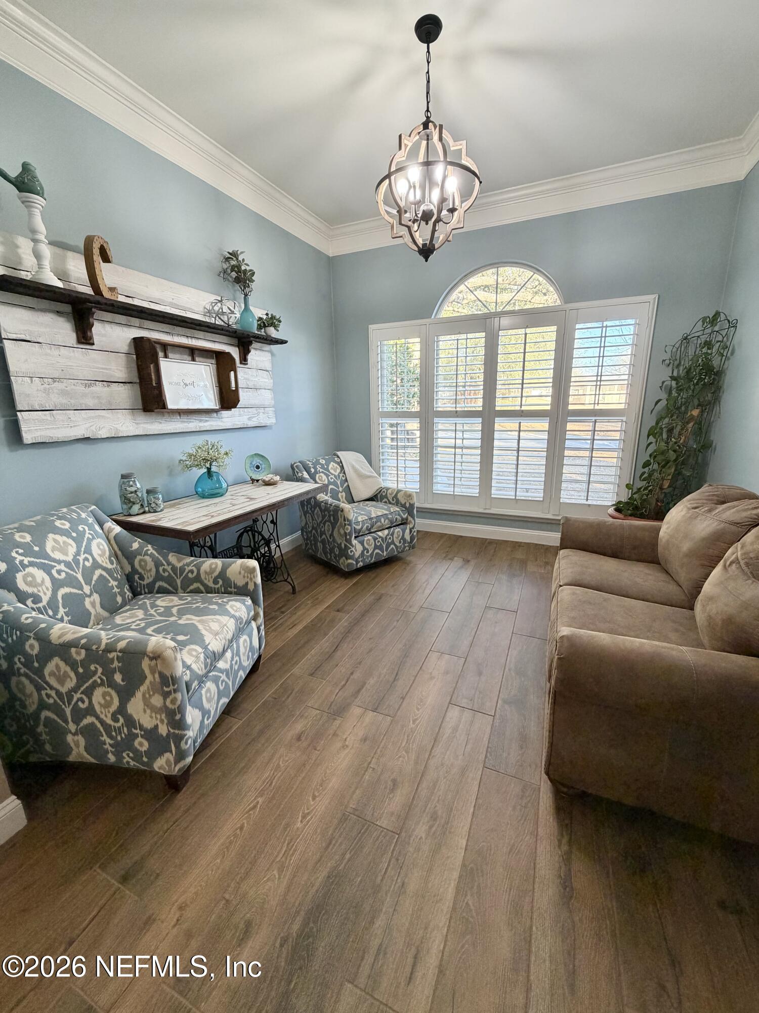 6116 Copper Drive Macclenny, FL 32063 - Photo 10 of 21 a living room with furniture and a chandelier