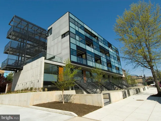 a view of a building with a yard