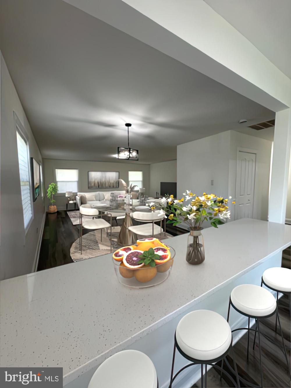 a living room with lots of furniture and chairs