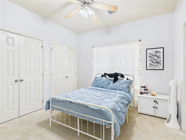 a bed room with a bed and a chandelier