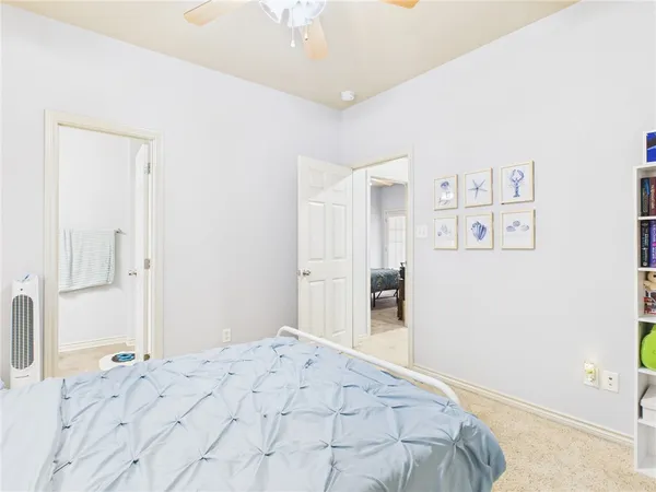 a bedroom with a bed and a cabinets