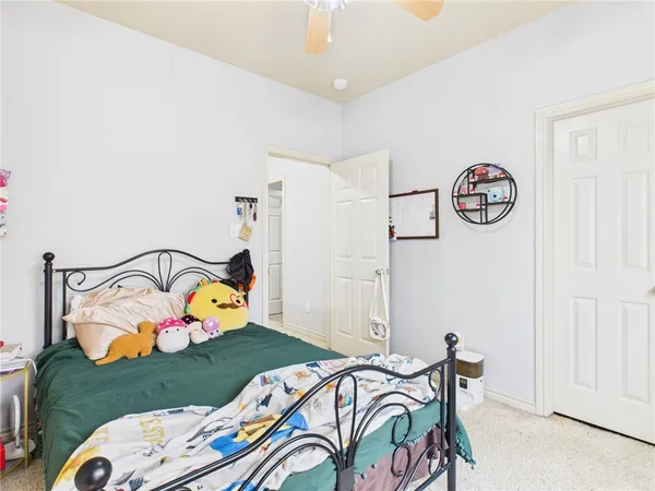 a bedroom with bed and a window