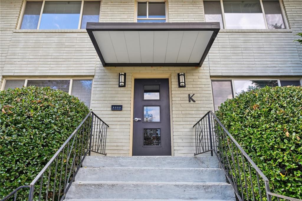 449 Clairemont Avenue, Unit K3 Decatur, GA 30030 - Photo 1 of 1 a front view of a house with stairs