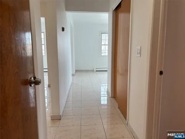wooden floor with a bathroom