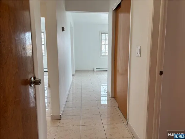 wooden floor with a bathroom
