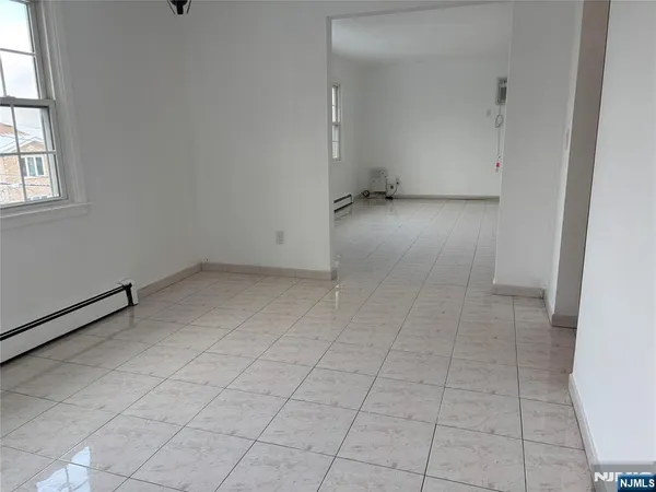 an empty room with white walls