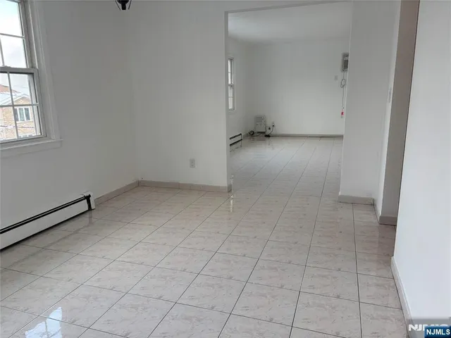 an empty room with white walls