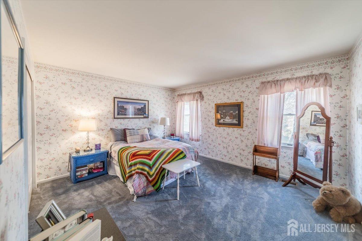 12 Adams Road Kendall Park, NJ 08824 - Photo 19 of 40 a bedroom with a bed and a cabinets
