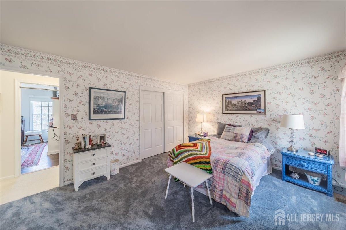 12 Adams Road Kendall Park, NJ 08824 - Photo 20 of 40 a bedroom with a bed and a desk