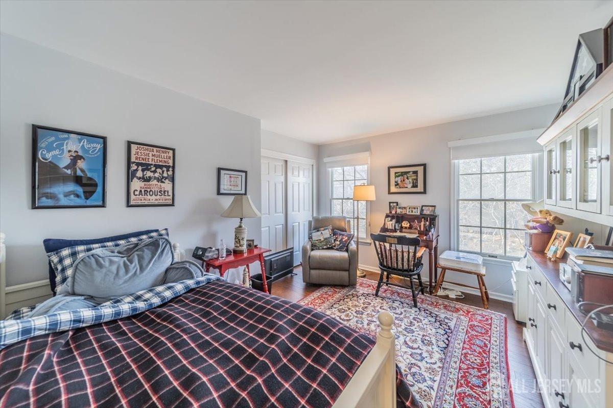12 Adams Road Kendall Park, NJ 08824 - Photo 23 of 40 a bedroom with furniture and a rug