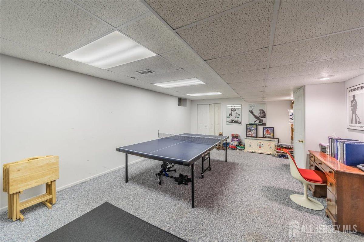 12 Adams Road Kendall Park, NJ 08824 - Photo 35 of 40 a room with furniture pool and a table