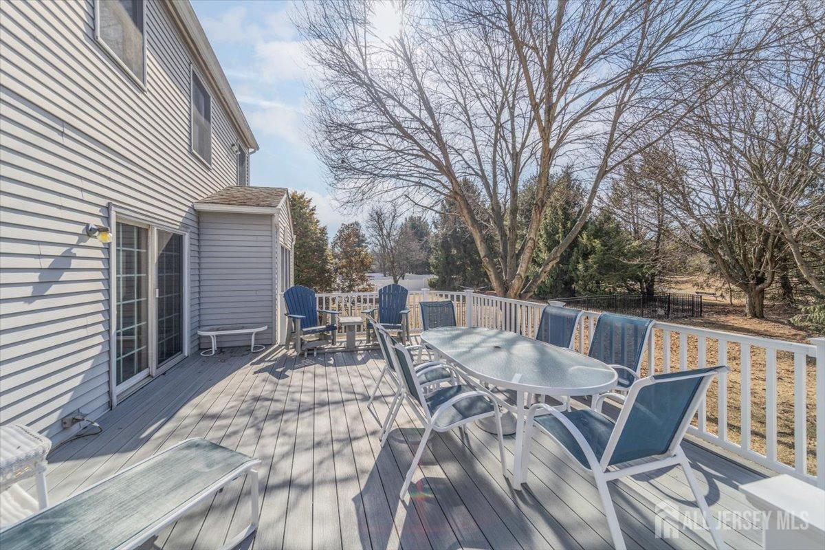 12 Adams Road Kendall Park, NJ 08824 - Photo 39 of 40 a view of a patio with iron fence
