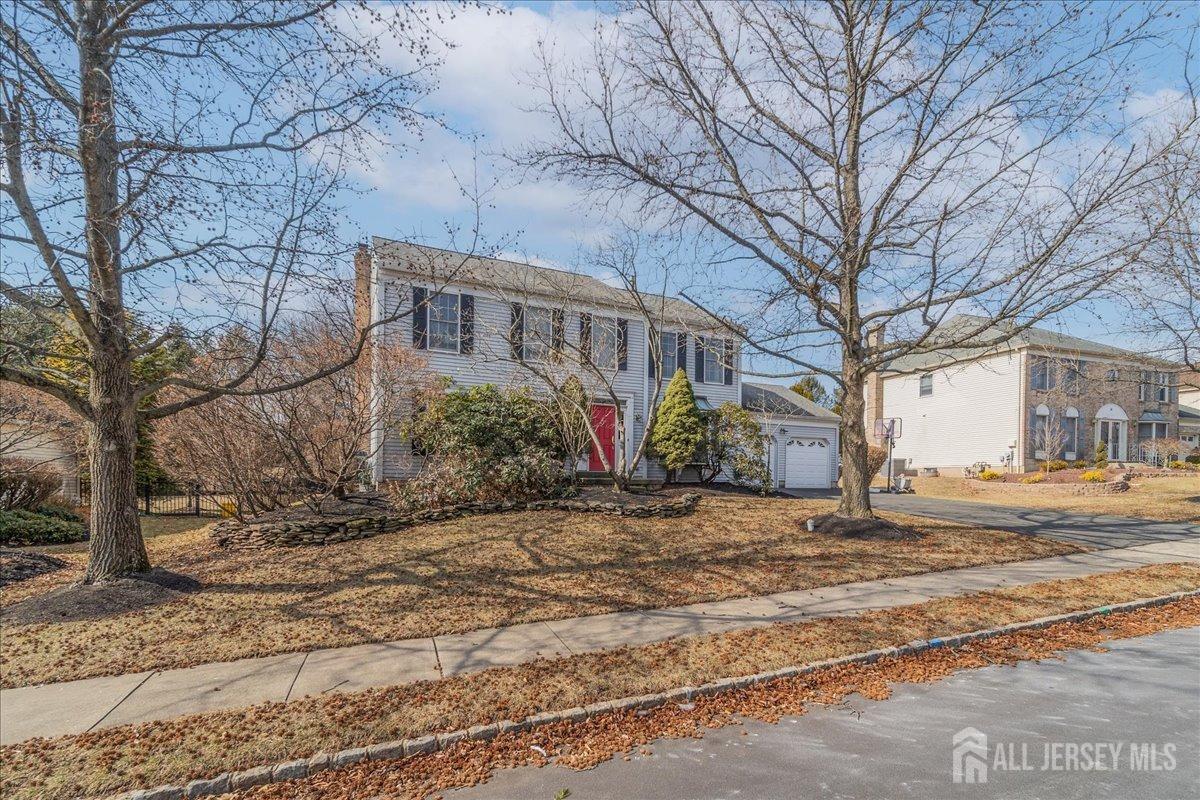 12 Adams Road Kendall Park, NJ 08824 - Photo 4 of 40 a front view of a house with a yard