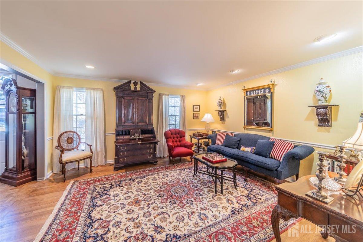 12 Adams Road Kendall Park, NJ 08824 - Photo 9 of 40 a living room with furniture and a flat screen tv